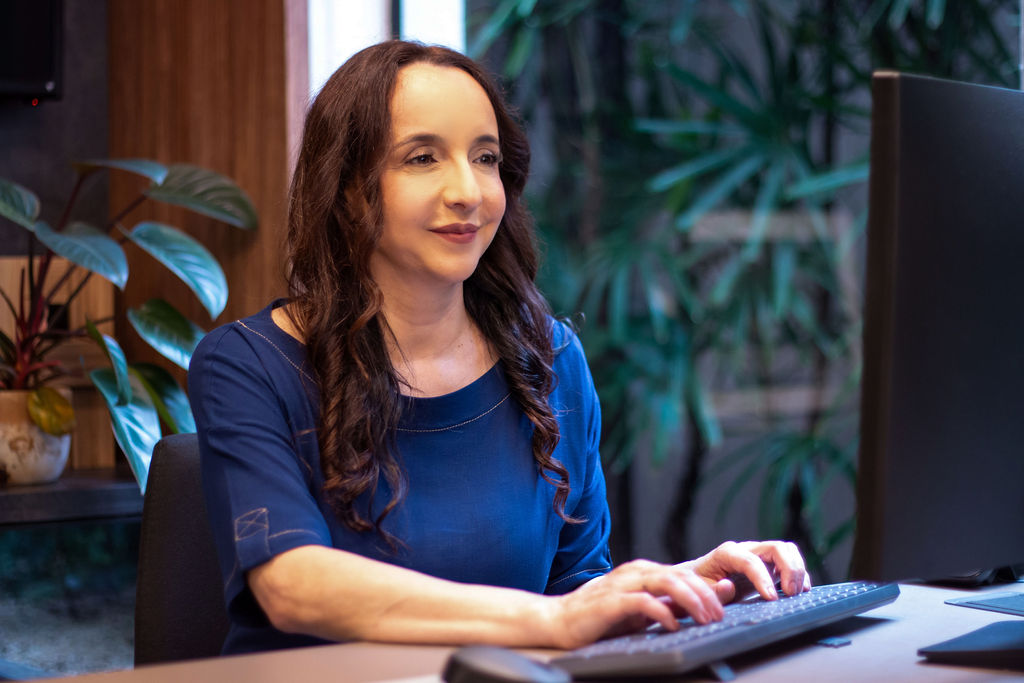 Psychotherapist working on laptop