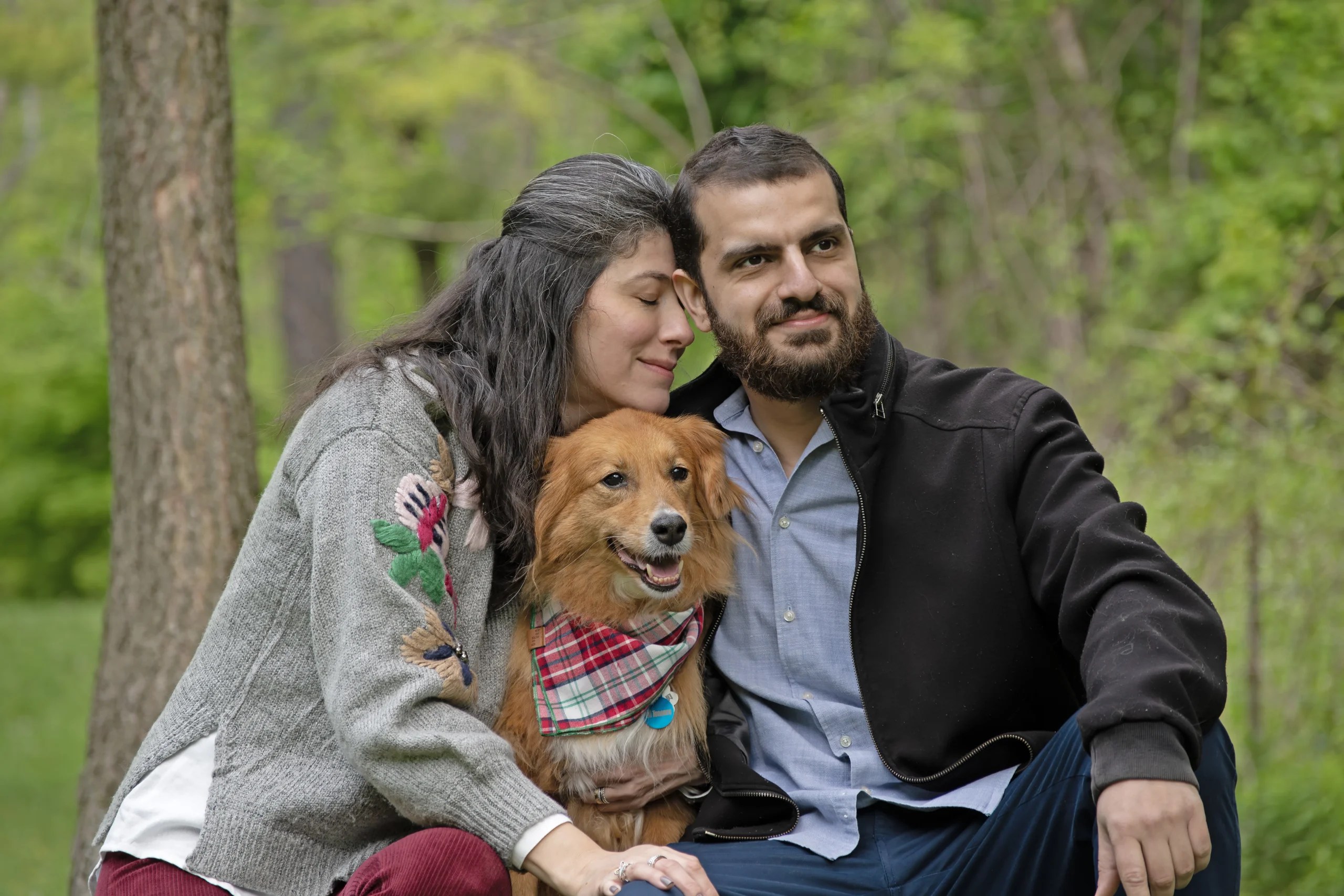 couple with a dog beetween them